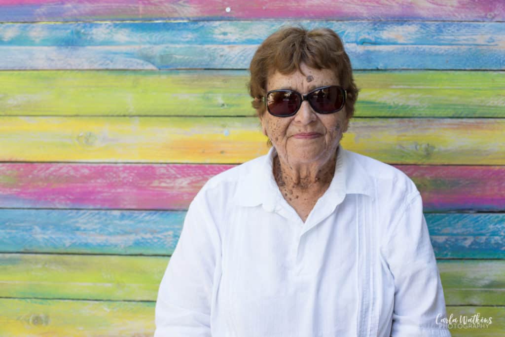 Gran in her sunglasses on a rainbow background | Carla Watkins Photography | carlawatkinsphotography.com